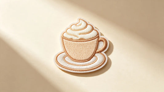 Single warm cafe-themed 3D raised foam embroidered patch, bright gentle studio product shot, delicate layered embroidery relief.