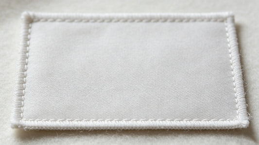 Flat clean blank backing of premium sew-on custom patch with zero glue residue