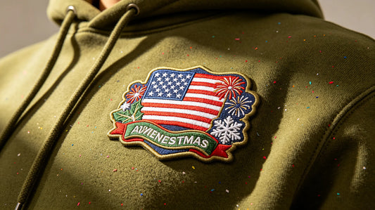 Close‑up of US holiday themed custom 3D embroidered patch sewn onto thick cotton hoodie, warm festive indoor lighting