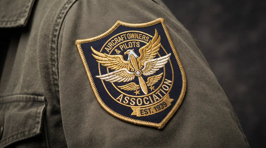 Vintage aviation shield shaped embroidered patch with intricate relief