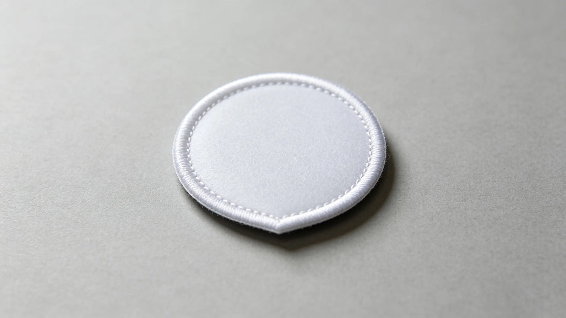 Detailed view of uniform heat seal adhesive layer on iron-on custom patch rear side