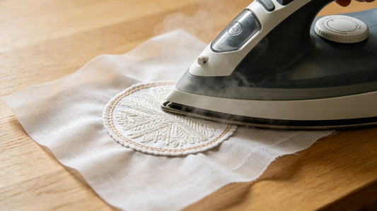 Step‑by‑step heat application process for iron‑on custom patch on jacket fabric