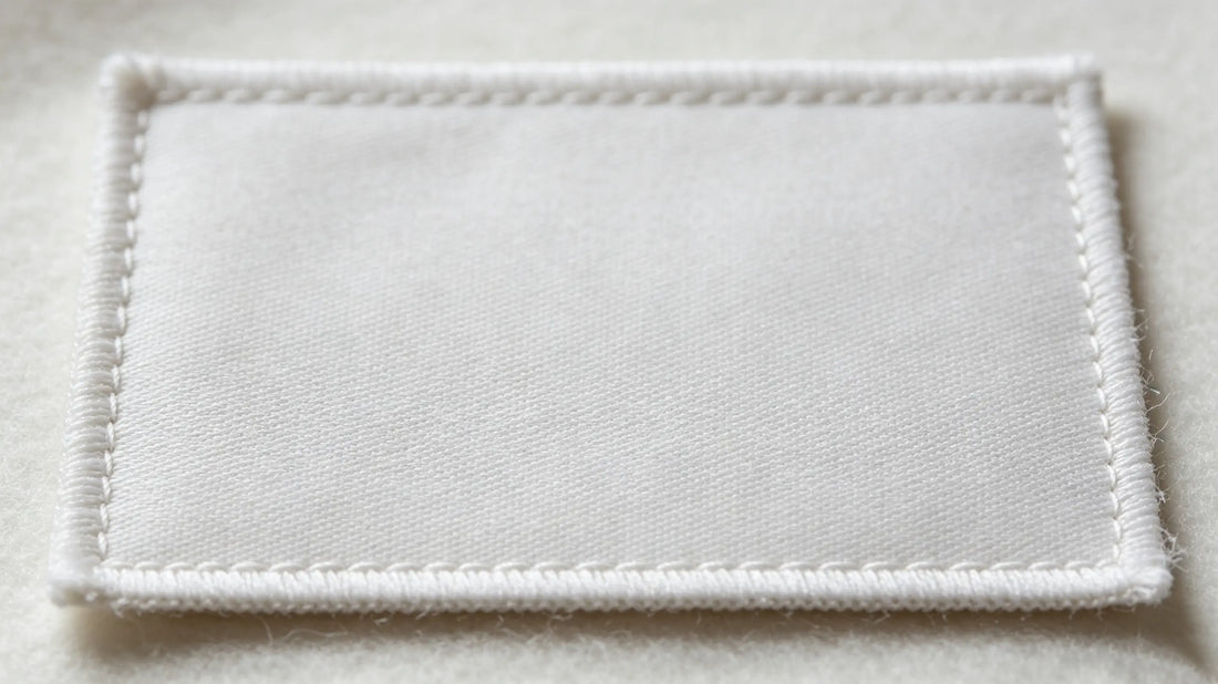 Flat clean blank backing of premium sew-on custom patch with zero glue residue