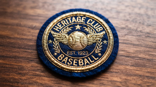Close-up of a Heritage Club vintage baseball patch featuring luxurious metallic gold threads and premium felt backing, representing high-end sports memorabilia craftsmanship.