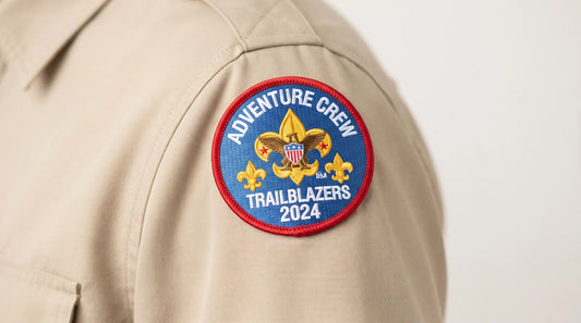 A close-up view of a custom scout patch expertly sewn onto a uniform sleeve, demonstrating high-quality craftsmanship and seamless design application.