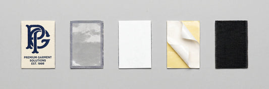 A 3:1 minimalist flat-lay knolling image featuring neatly organized, non-touching premium woven patches, individually displaying the 50D/75D jacquard front fabric details and various backing techniques on a light-grey background.