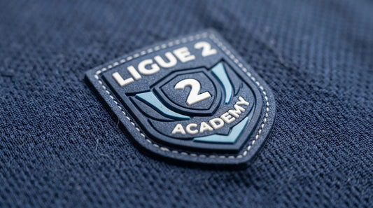 Close-up of 3D silicone soccer patch on professional Ligue 2 Academy jersey