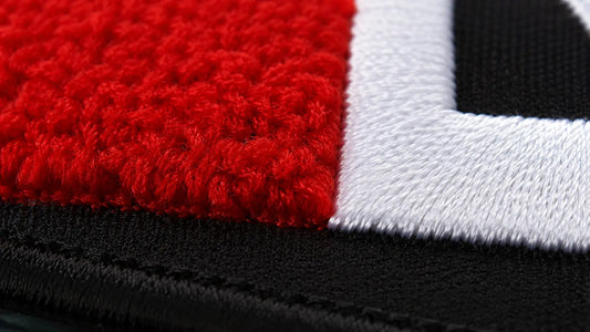 Seamless integration of plush chenille texture and razor-sharp flat embroidery corners on a custom patch.